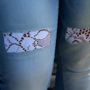 Jeans with inserted white lace
