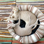 Siamese-cats-in-cat-bed