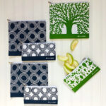 Lunchskins zippered bags in green tree patterns and charcoal circle patterns