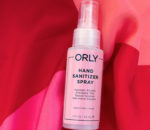 ORLY bottle of hand sanitizer on red and pink cloth
