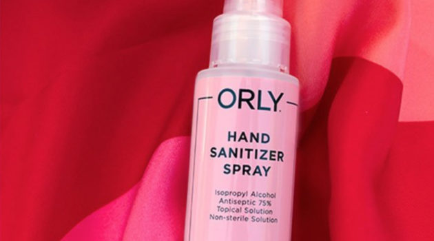 ORLY bottle of hand sanitizer on red and pink cloth