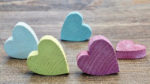 Wooden colored hearts in lime, pink and turqoise