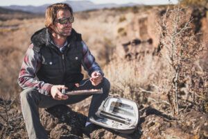 Man having an outdoor meal made with the GoSun Go solar oven